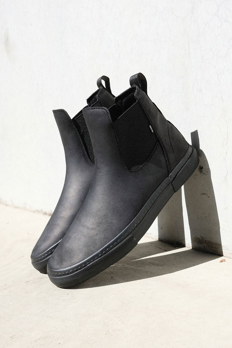 Outsole close up of black Dover II boot showing herringbone tread and Globe branding.
