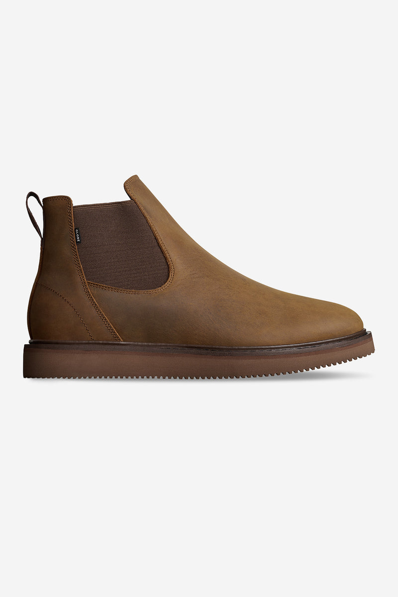 Side view of Dover II Vibram brown Crazyhorse Chelsea boot with elastic panel and rugged brown sole.