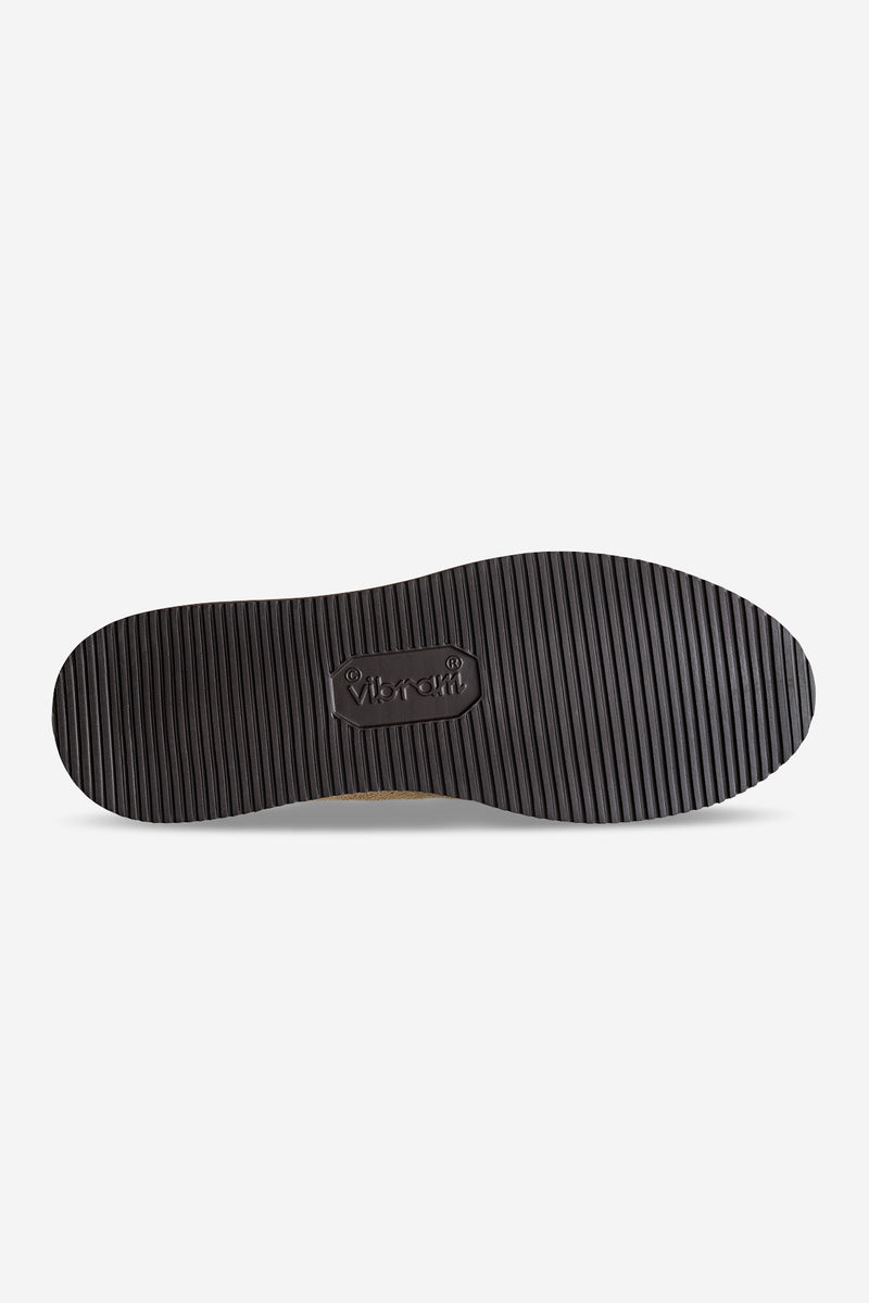 Bottom view of Dover II Vibram boot outsole in black with ribbed tread and Vibram logo