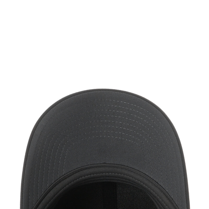 Black Nike cap brim close-up, textured fabric and double-stitched edge