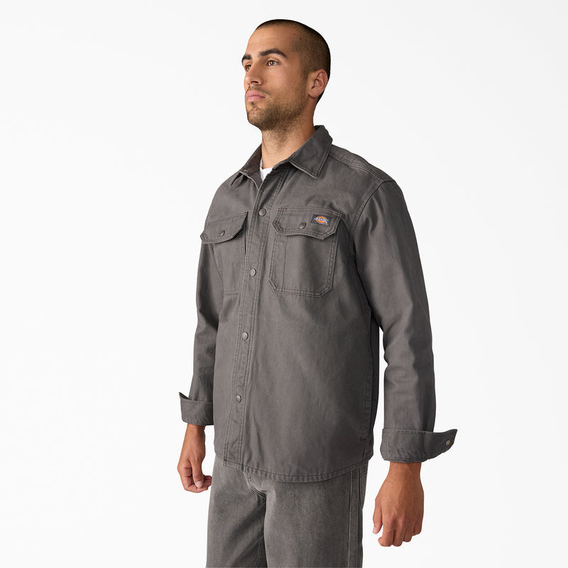 Men's duck shirt jacket in dark gray, side view with stand collar and flap chest pocket.