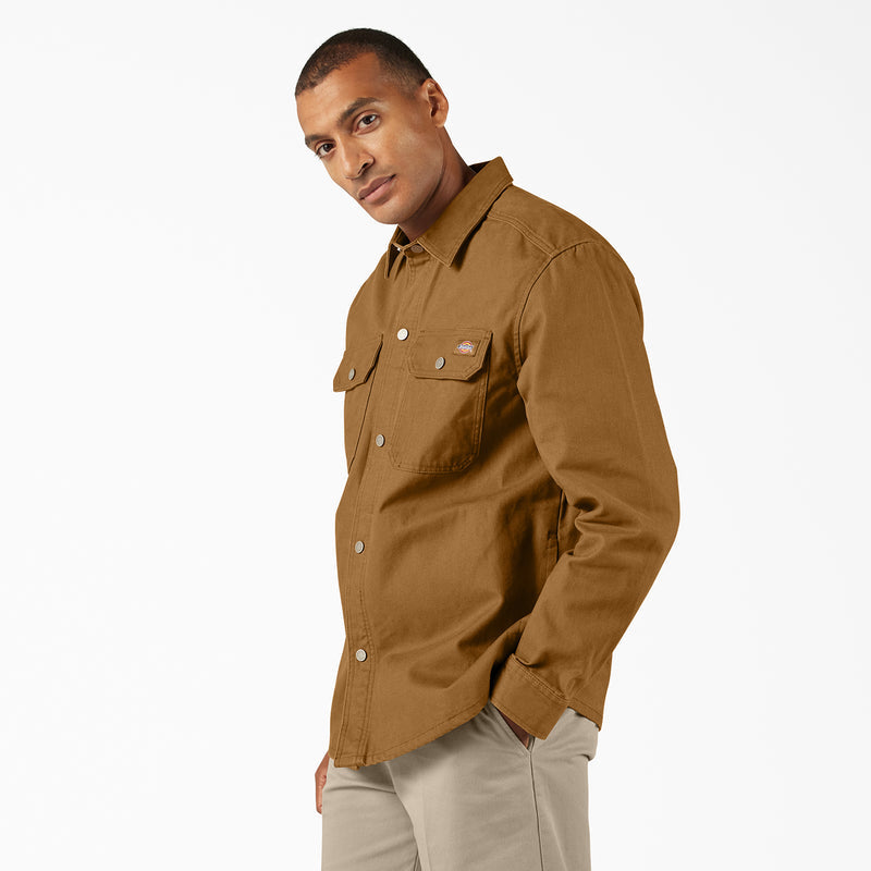 Men's brown duck shirt jacket, angled side view with chest flap pockets and button front