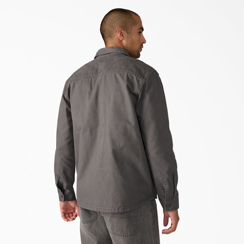 Men's duck shirt jacket back view in dark gray, button closures and curved hem.