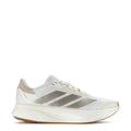 White women's running shoes with metallic 3-stripe accents and gum rubber sole