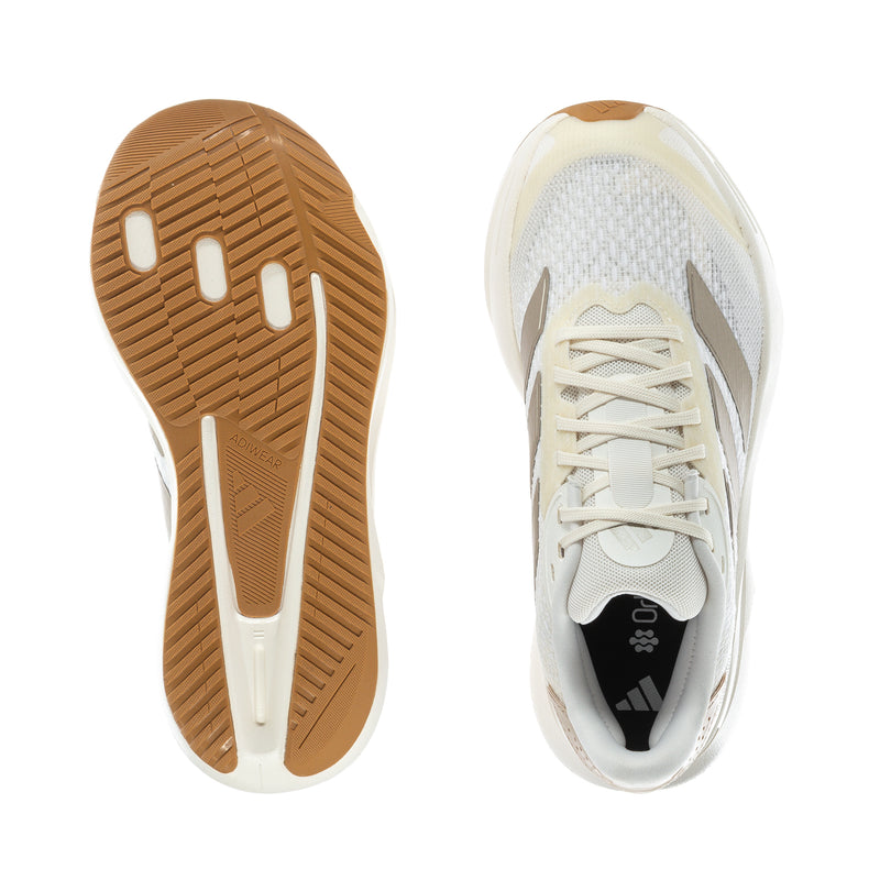 Shoe outsole tread and cushioned heel collar in white with gum rubber base