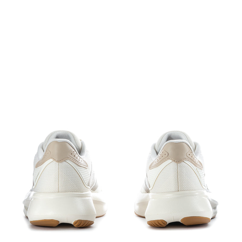 White women's running shoes with padded collar and gum outsole, rear view
