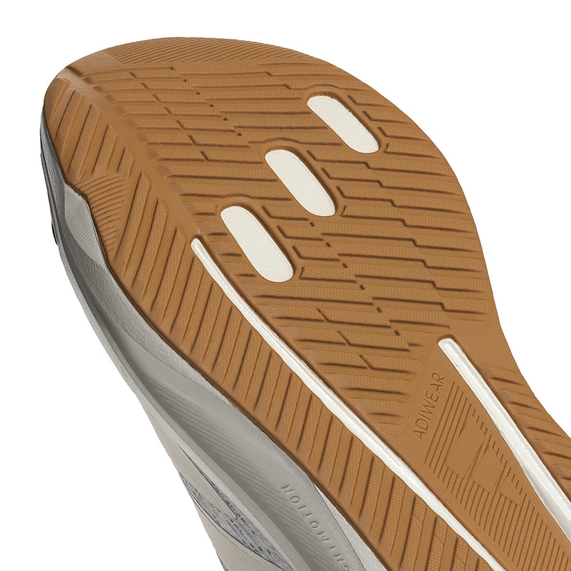Brown-and-white outsole tread with multi-channel traction pattern