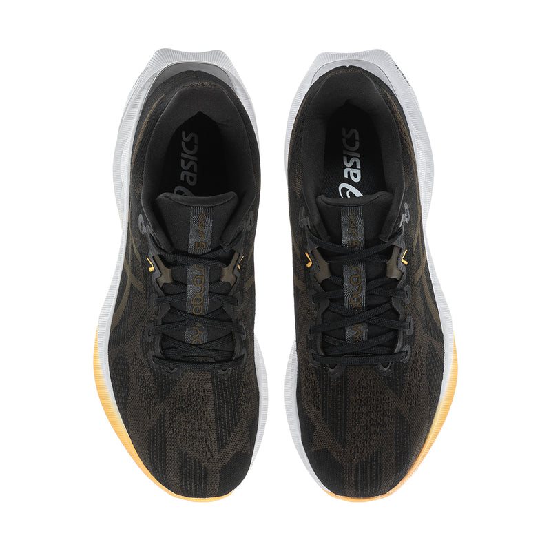 Men's black running shoes, top view showing padded tongue and lace-up interior