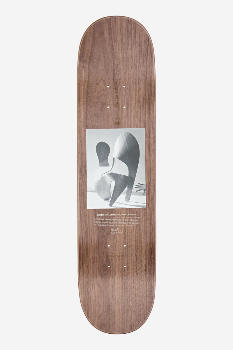 Eames Silhouette 8.0 walnut plywood deck with grayscale artwork near the lower half and wall mounting hardware for display