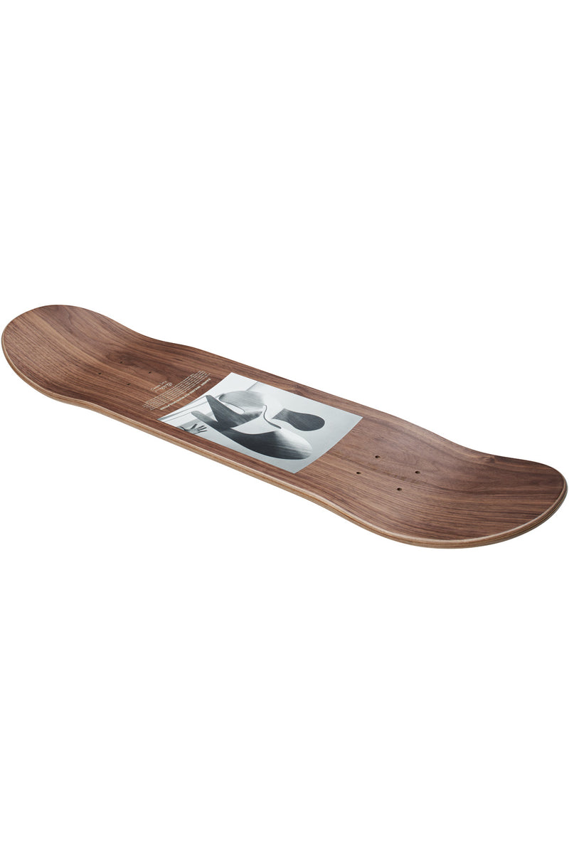 Angled view of the walnut plywood deck with a grayscale art print centered on the board