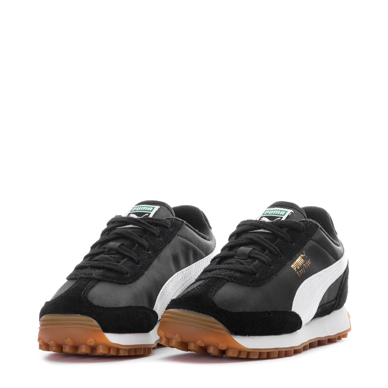 Kids Puma lace-up sneakers, black with white stripes, pair front angled view.