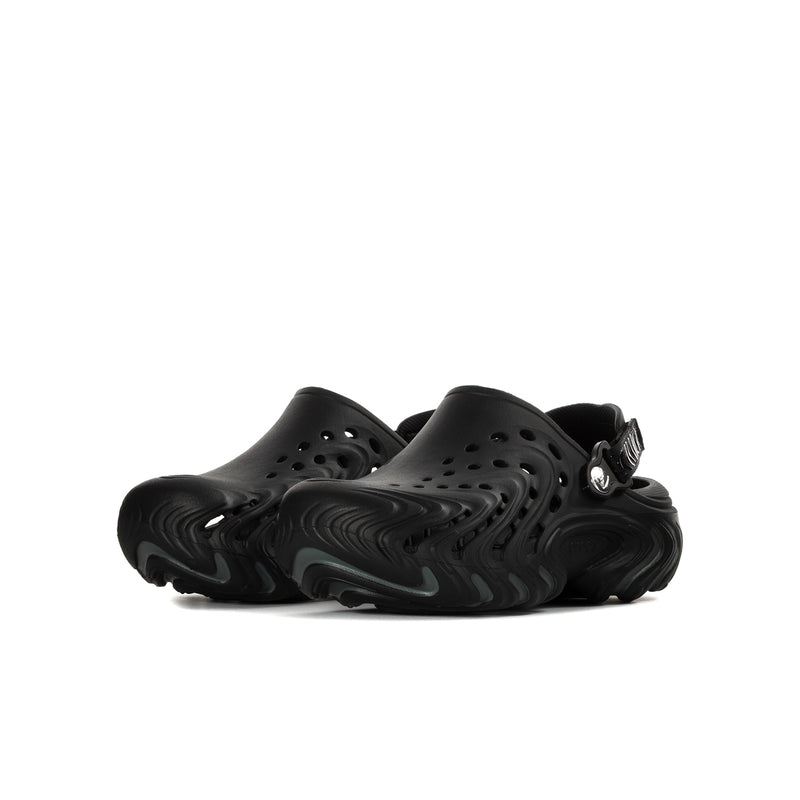 Black youth slip-on clogs with vented top and side strap, sculpted sole