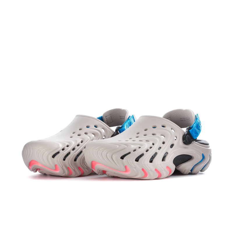 Men's white clogs side view with perforations and blue strap detail