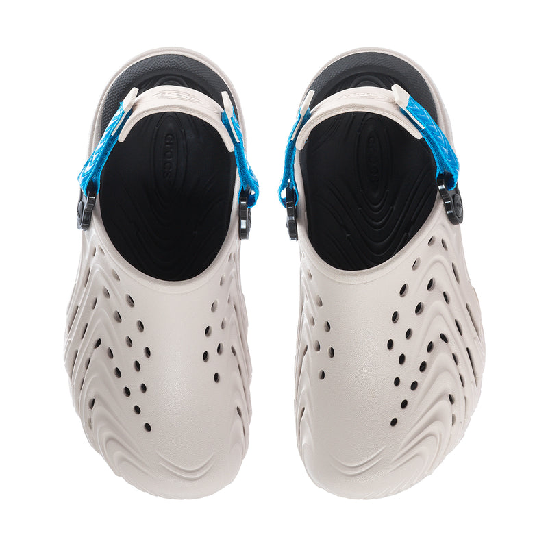 Men's clogs back view with black lining, blue straps, and vented white uppers