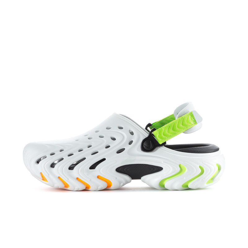 Men's white clog with green strap, perforations, and orange-yellow wavy outsole edges