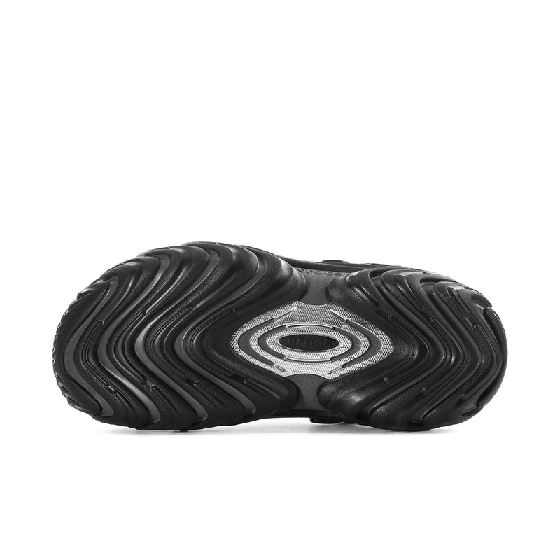 Men's black clogs with textured outsole and molded wave traction pattern