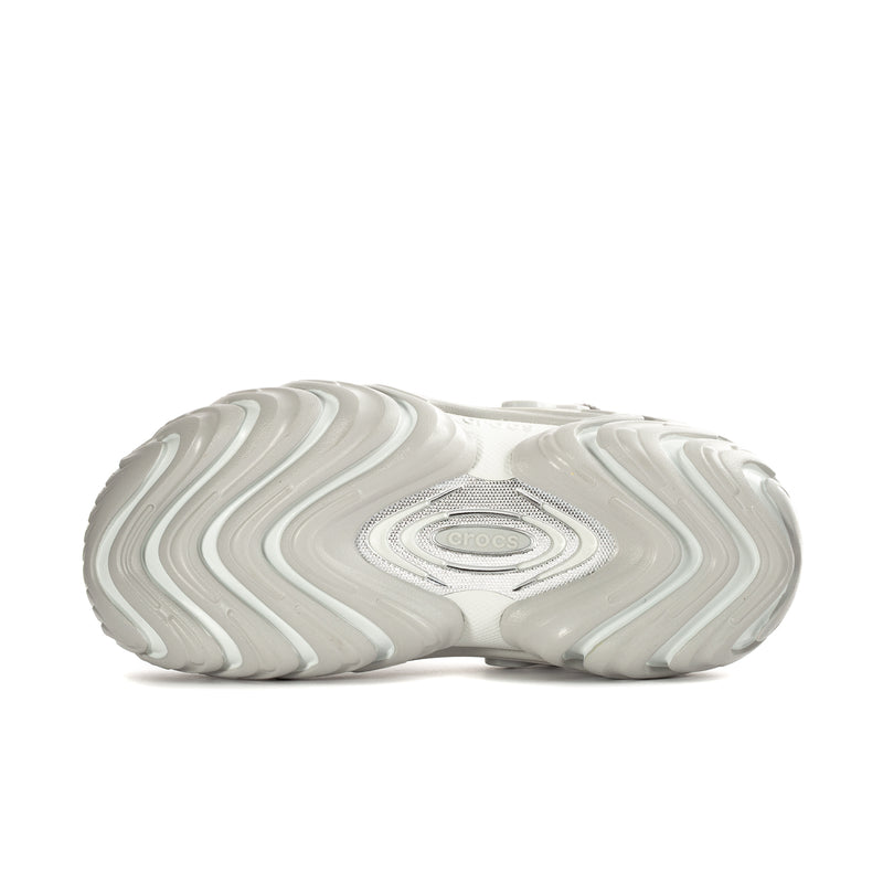 Mens white clog outsole with wavy tread pattern and oval heel logo