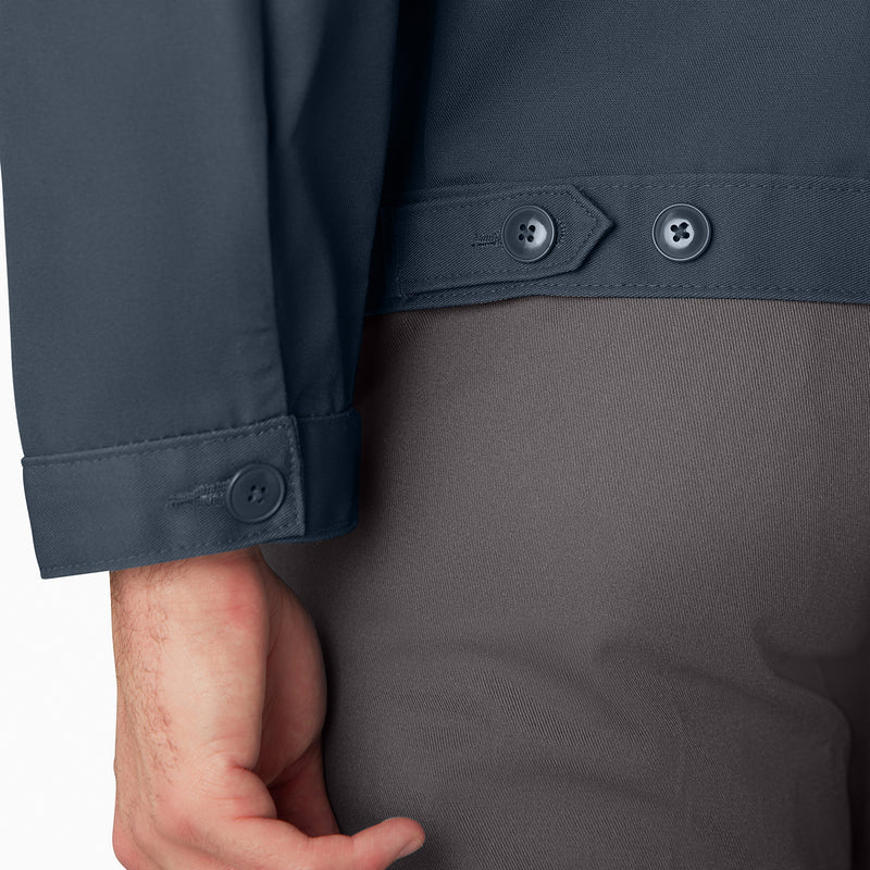 Airforce blue jacket sleeve cuff with button tabs, over gray pants