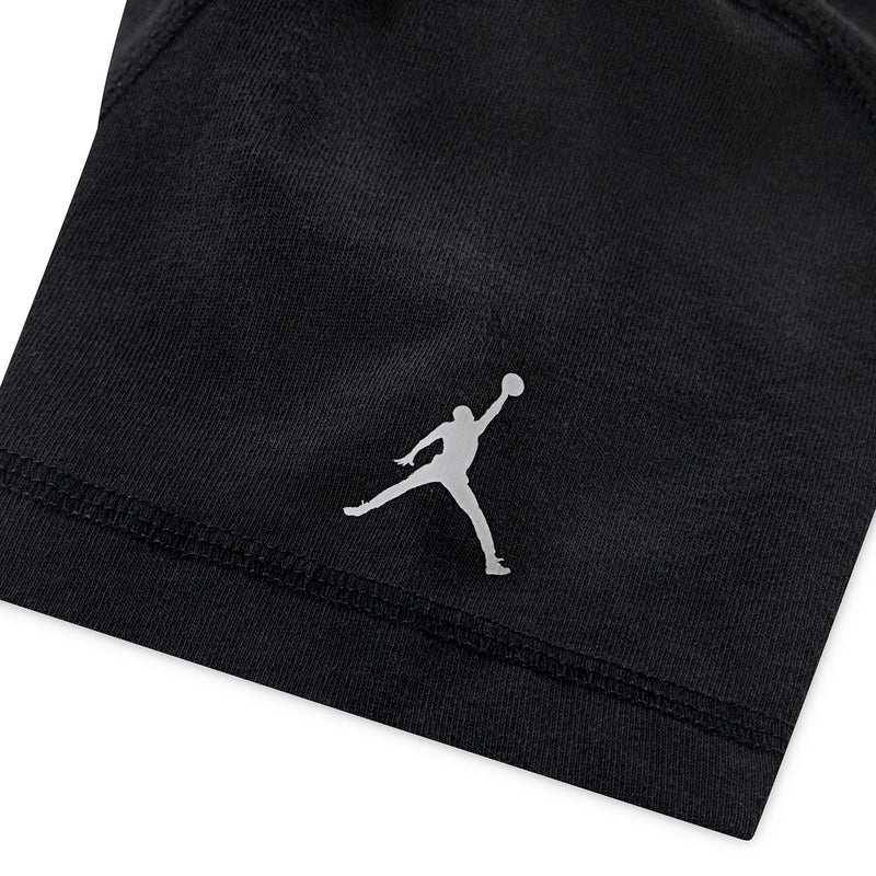 Youth Jordan wash tee sleeve hem detail with small Jumpman logo, dark black.