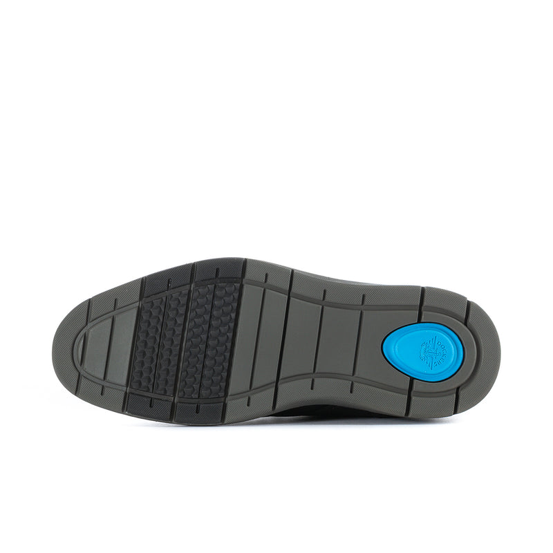Men's chukka boot outsole with textured tread and blue accent circle