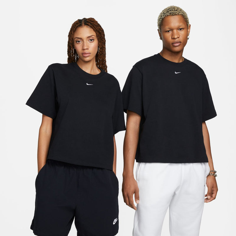 Women's black boxy T-shirt on two models, Nike swoosh at upper chest