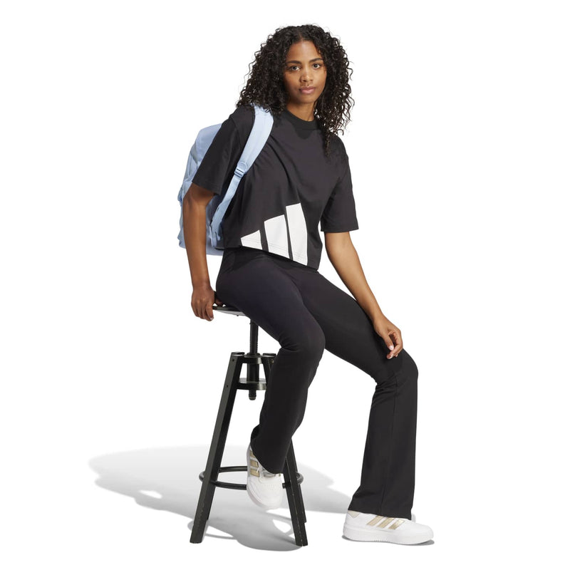 Women's black crew-neck T-shirt featuring a large white logo graphic on front