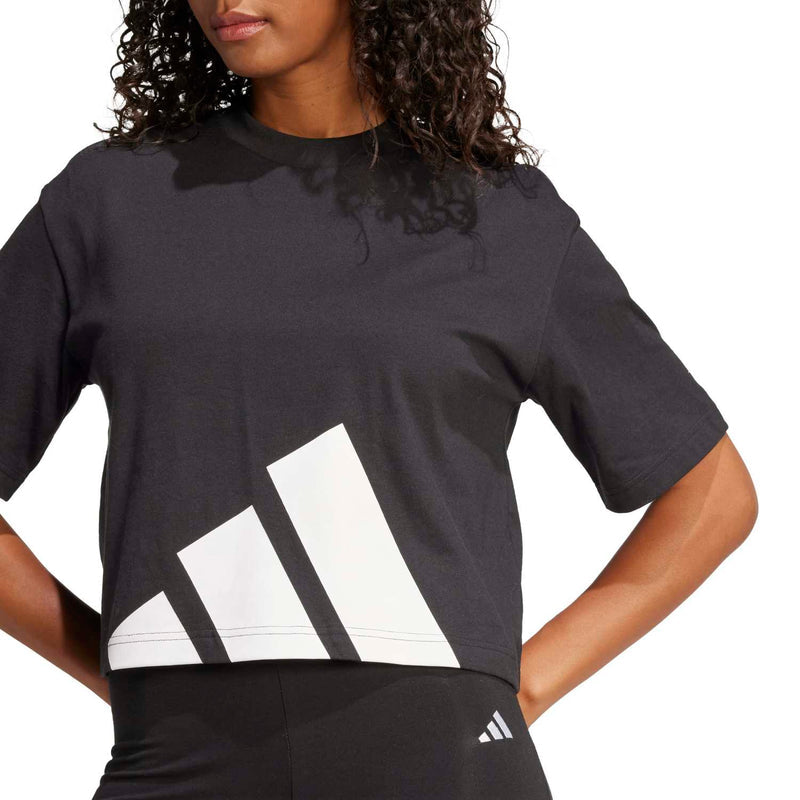 Women's black T-shirt close-up: crew neck and large white logo graphic front