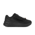 Women's black lace-up athletic sneakers with thick rubber sole and tread