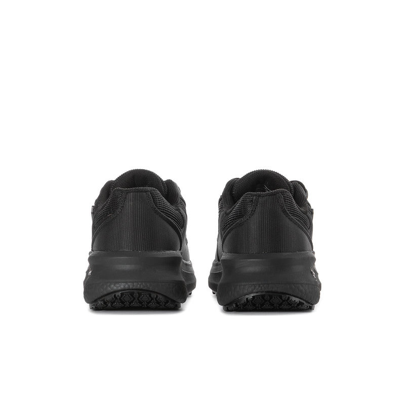 Women's black sneakers, back view with heel tab and textured outsole