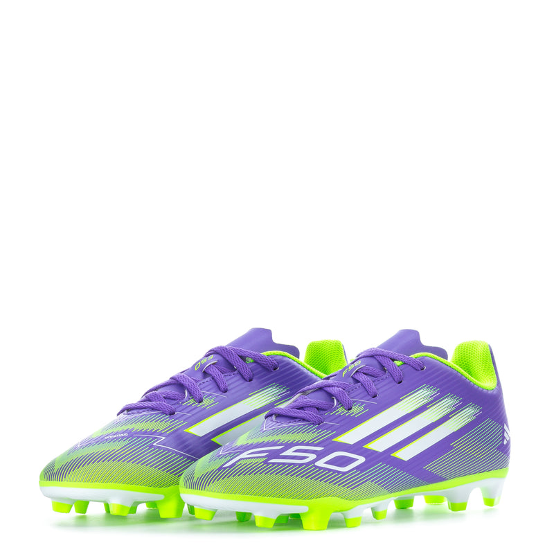 Pair of purple youth soccer cleats with lime green outsoles and firm-ground studs