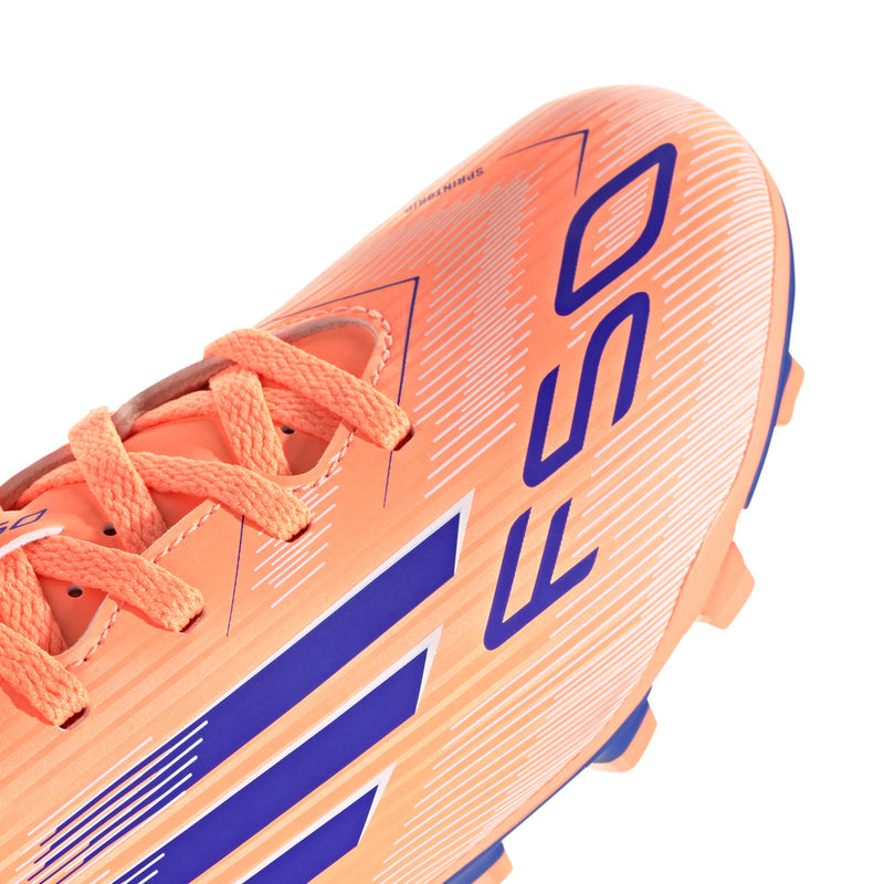 Youth FG soccer cleats, orange synthetic upper with blue logo and lace-up closure.