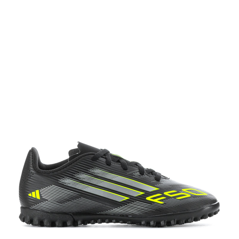 Youth black soccer cleats with neon green stripes and lace-up design, turf studs