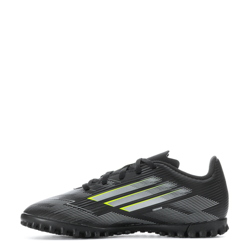 Youth black soccer cleats with neon green logo stripes, textured upper, molded studs