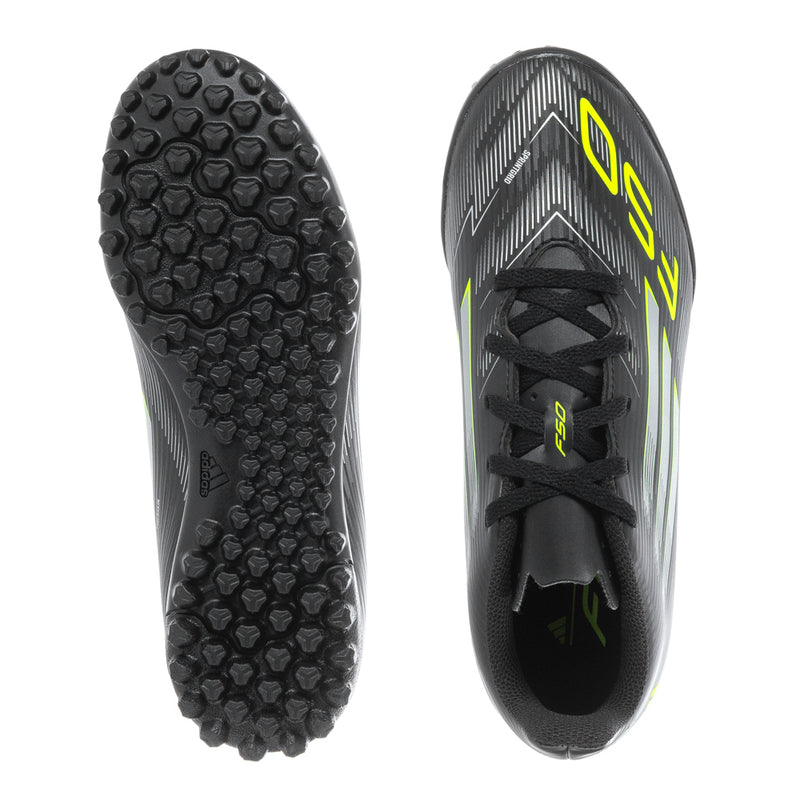 Pair of youth soccer cleats: black studded outsole and black lace-up upper