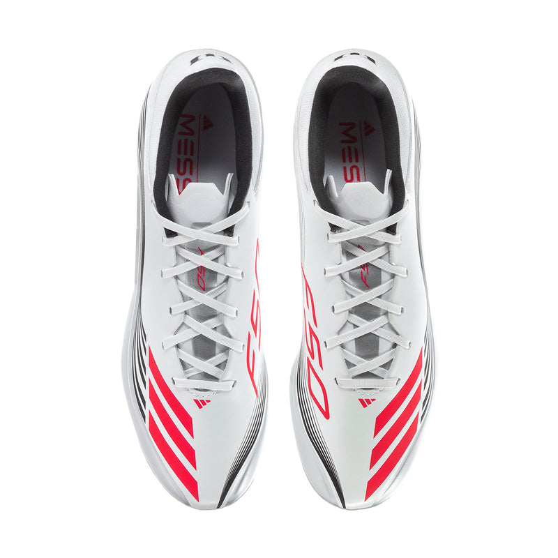 Pair of men’s white soccer cleats with red striping and lace-up design