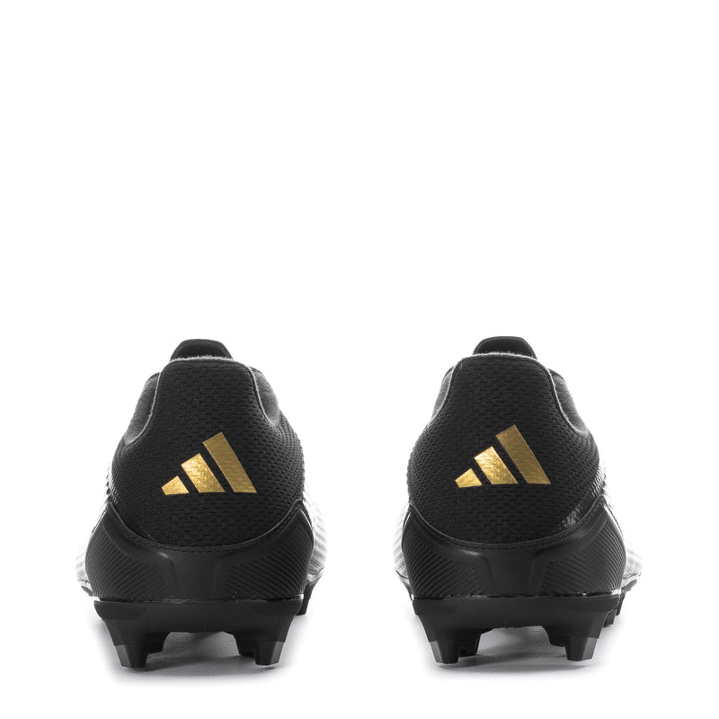 Men's soccer cleats, heel view in black with gold logo and molded studs
