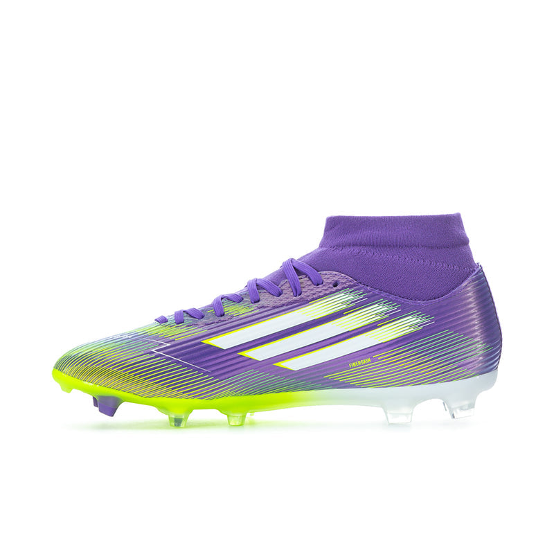 Men's mid-cut soccer cleats in purple with neon green accents and studded outsole