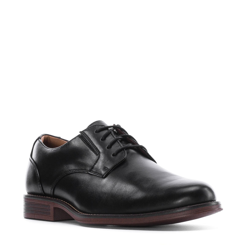 Men's black leather lace-up dress shoe, side view, with brown block heel