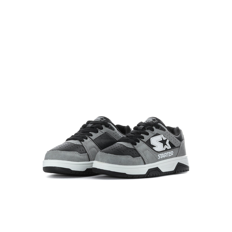 Kids pair of low-top sneakers, black and gray with white midsoles and star badges