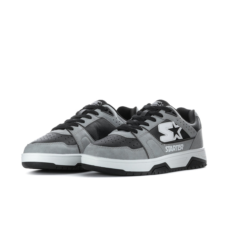 Men's grey and black low-top sneakers, side-by-side view, lace-up with star emblem