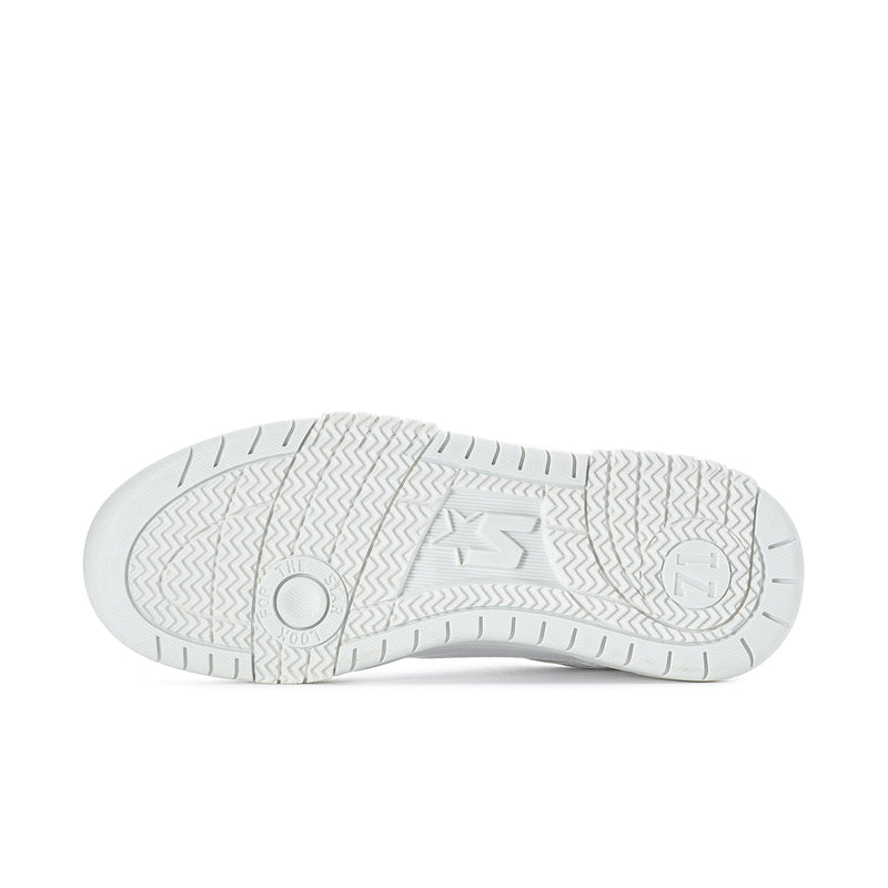 Women's white low-top sneakers, outsole view with star logo and tread pattern