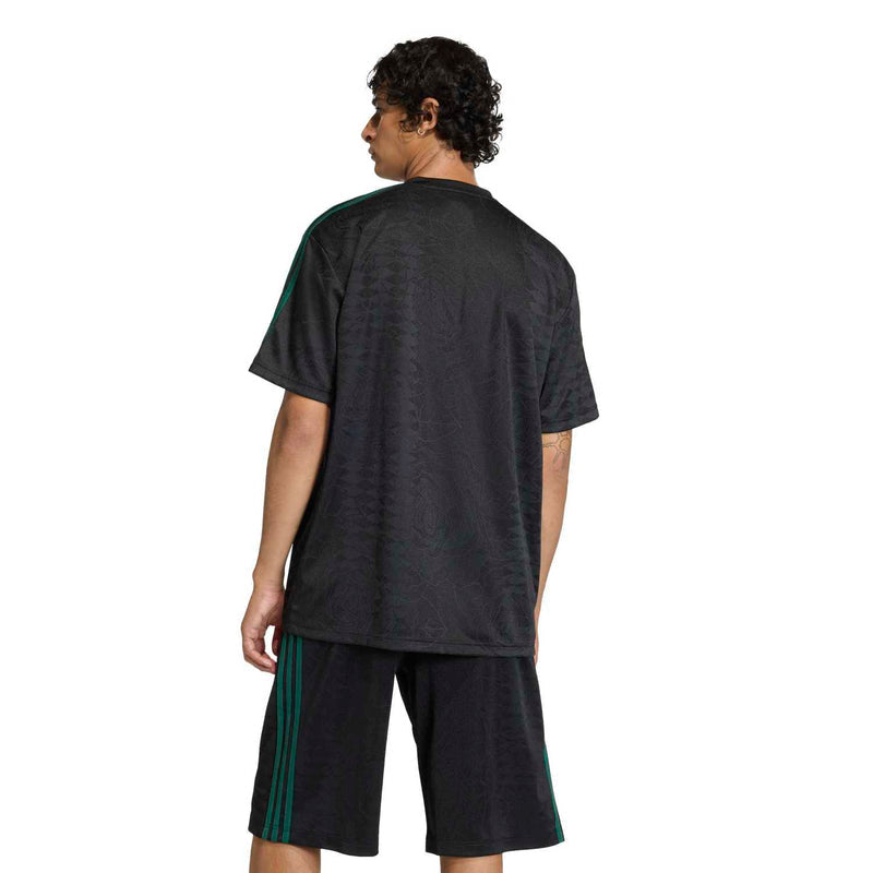 Men's black football jersey back view with green side stripes