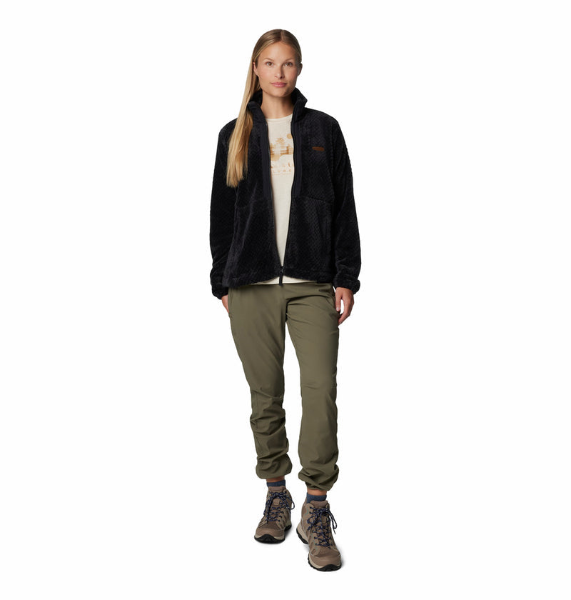 Women's black full-zip fleece jacket worn with olive pants, full-body view