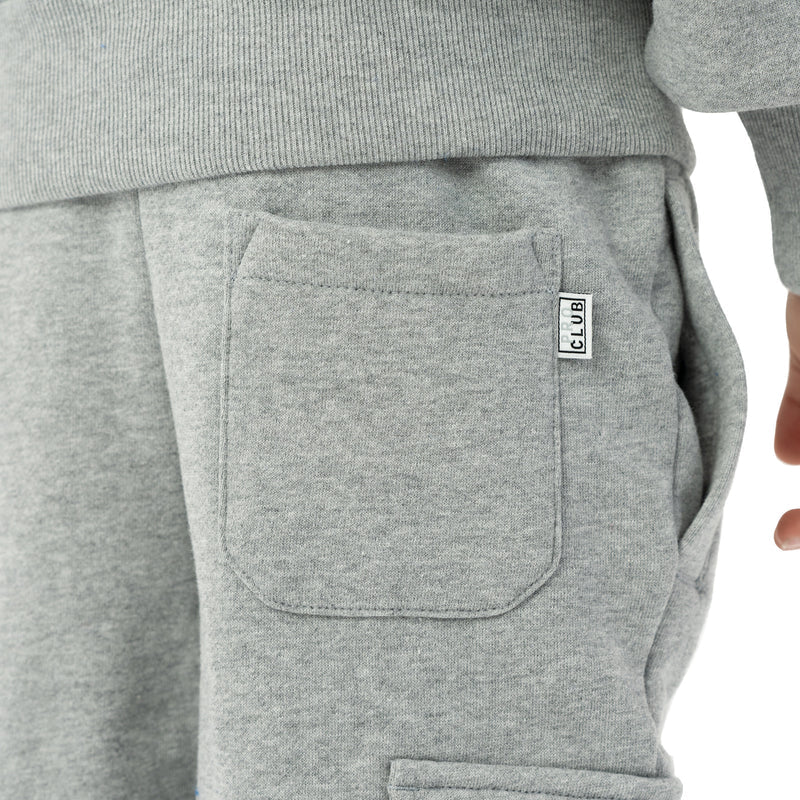 Heather grey fleece cargo pocket close-up with stitched edges and PR CLUB patch