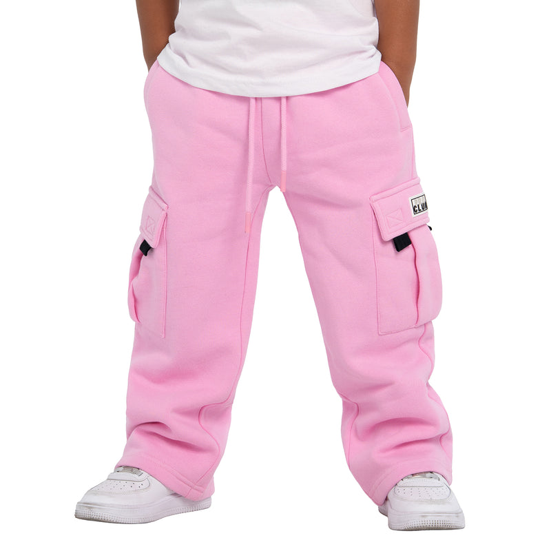 Youth pink fleece cargo sweatpants on feet, side cargo pockets with black zipper tabs