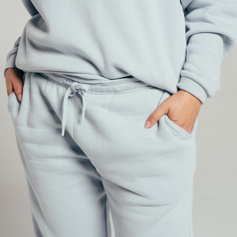 Women's light blue fleece pants with front drawstring and elastic waistband