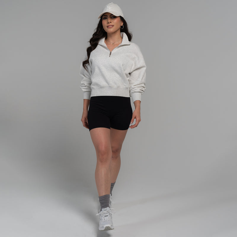 Women's ash heather fleece quarter-zip pullover on model, front view