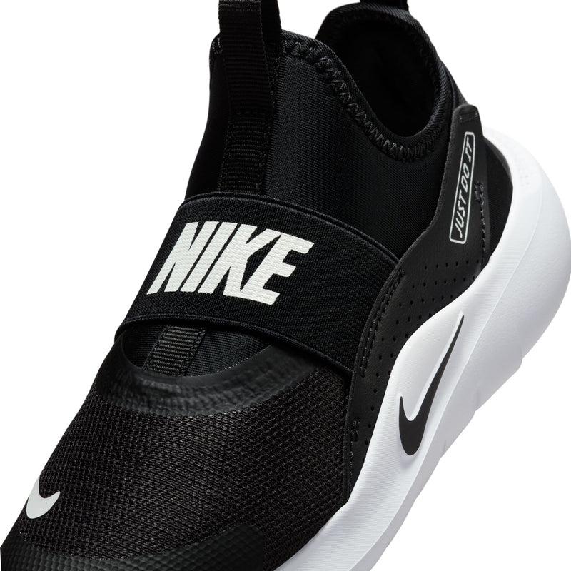 Kids black slip-on shoes close-up of heel collar with NIKE strap and Swoosh