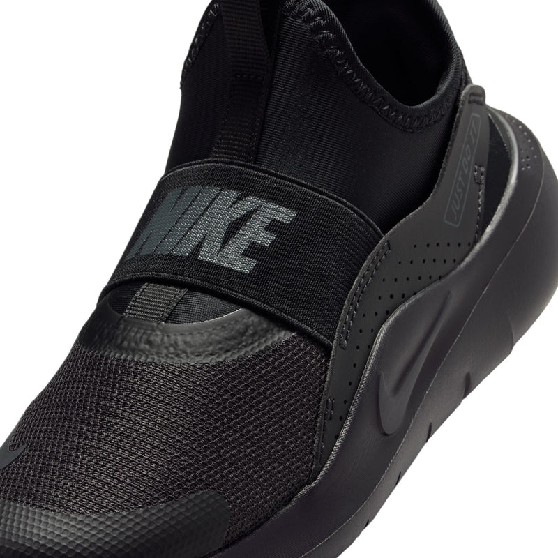 Kids black shoe upper close-up with FLEX strap and textured mesh panels