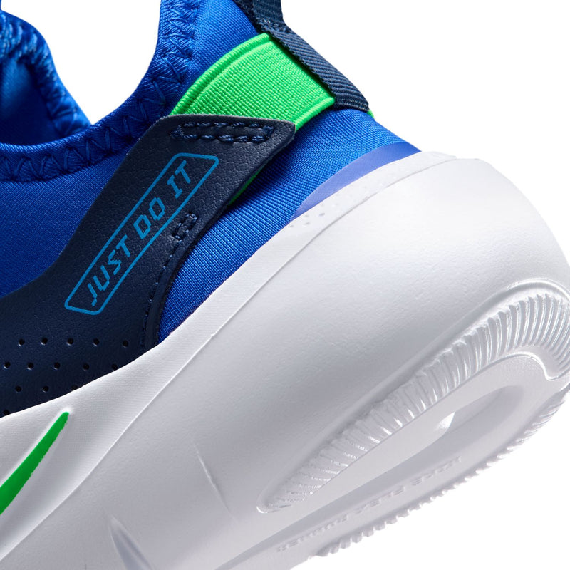 Close-up of kids blue shoe side with green heel label and white sole